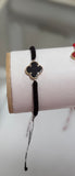 Clover Negra cubierto en Oro 14kt con pulso tejido en negro